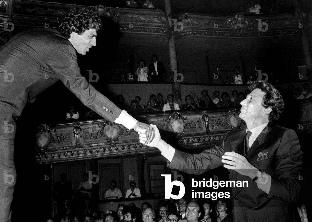 French Singer Enrico Macias on Stage during Homage To Singer Georgesbrassens in Sete here Congratulated By Presenter Michel Drucker June 24, 1985 (b/w photo)