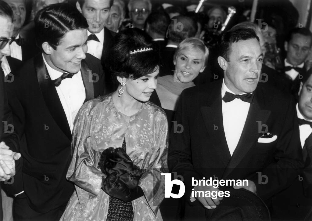 Jacques Charrier, Pascale Petit and Gene Kelly at Cannes Film Festival on May 2, 1959 (b/w photo)