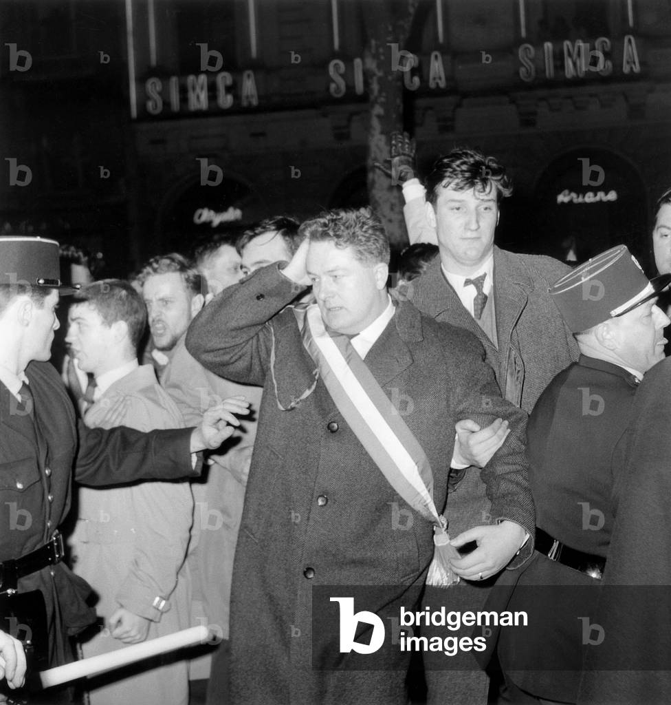 French Deputy Jean-Marie Le Pen Hit in The Head here With Other Staunch Supporters of French Algeria during Demonstrating on The Champs Elysees February 28, 1961 To Protest Against The Visit in Paris of Tunisian President Habibbourguiba (Member of The Arab League Supporting Decolonization in The World and Especially Tunisia and Morocco Support Algeria Since 1956) during War in Algeria (b/w photo)
