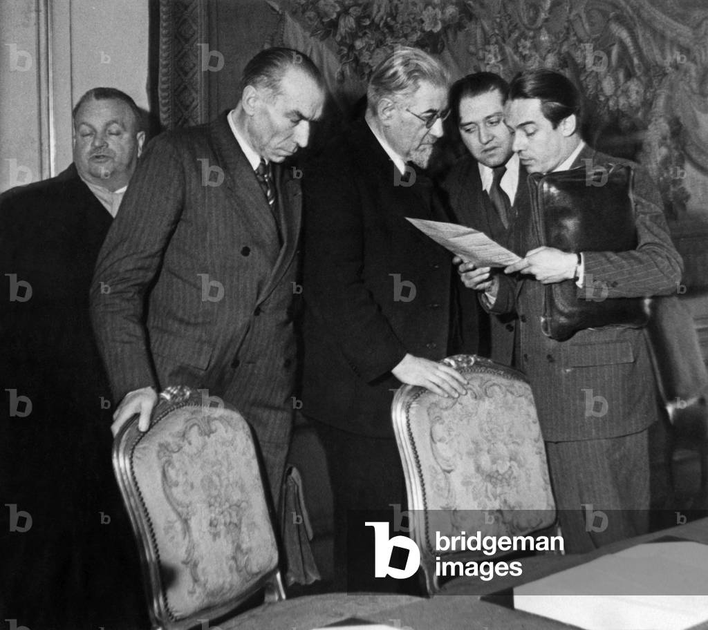Pierre Bourdan, Minister of Youth, Arts and Letters Responsible for Information, Discuss with Prime Minister Paul Ramadier at the end of his Government's First Cabinet Council at Hotel Matignon January 25, 1947. Mr. Maroselli, Minister of Air, Andre Marie, Minister of Justice and Mr. Segala, Secretary General Dela President of the Government (b/w photo)