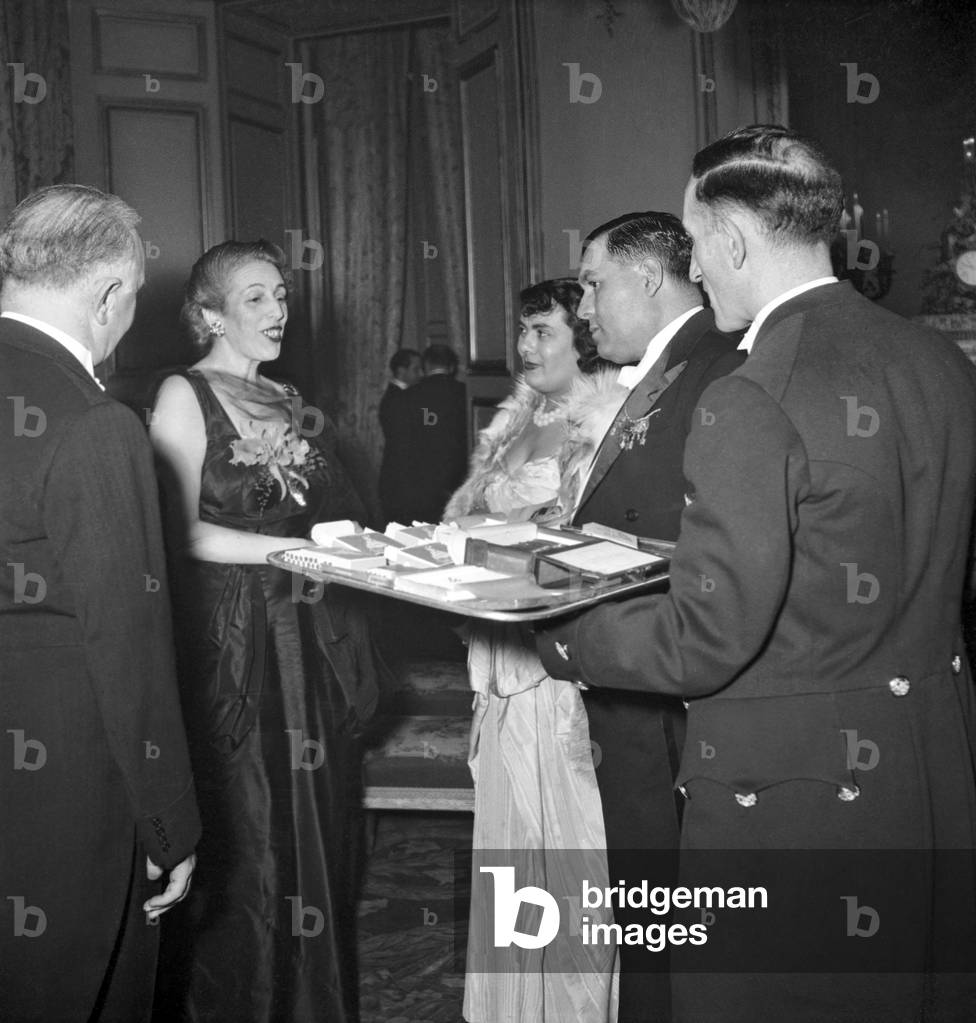 Reception Given at The Elysee, Paris, on February 23, 1949 : Cigarettes and Cigars Are Given To Mrs Vittorio Roca (Wife of Argentinian Ambassador in Paris), Paul Coste-Floret and his Wife (b/w photo)