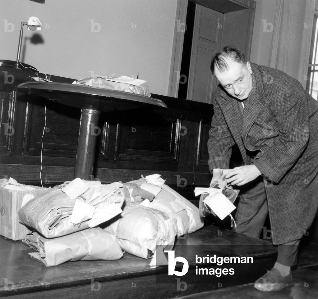 French Political Journalist Pottecher Examines Exhibits during Trial France Justice (b/w photo)