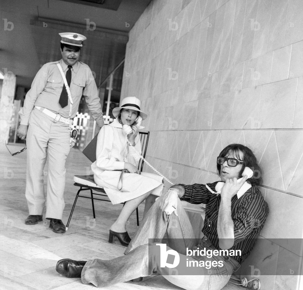 French singer and actress Dani (Daniele Graule) on holidays in Tunisia, June 21, 1974 here in Skanes with a policeman and Patrick Topaloff (b/w photo)