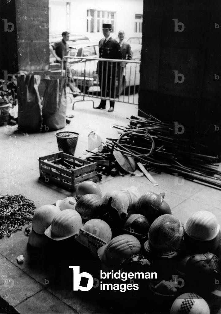 Helmets, chains and iron bars seized by the police inside the Sorbonne and provisionally entered the Court of the Judicial Police on June 17, 1968 (b/w photo)