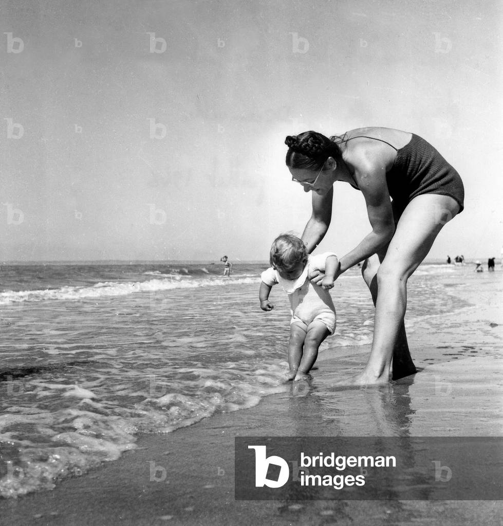 A Mom And Her Bebe On A Beach From Deauville July 1946 (b/w photo)