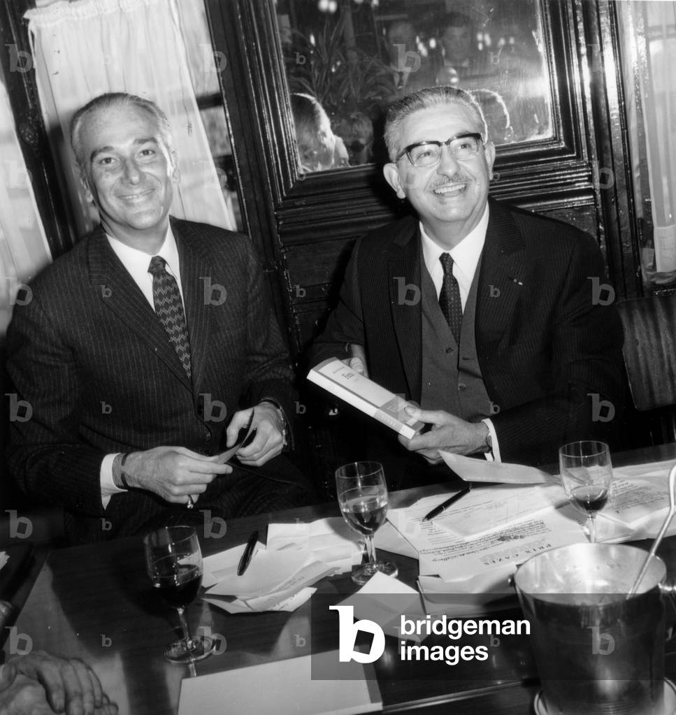 Cazes Prize Given To Jose Luis De Villalonga (L) By Roger Cazes March 24, 1971 in Lipp Brasserie, Paris (b/w photo)