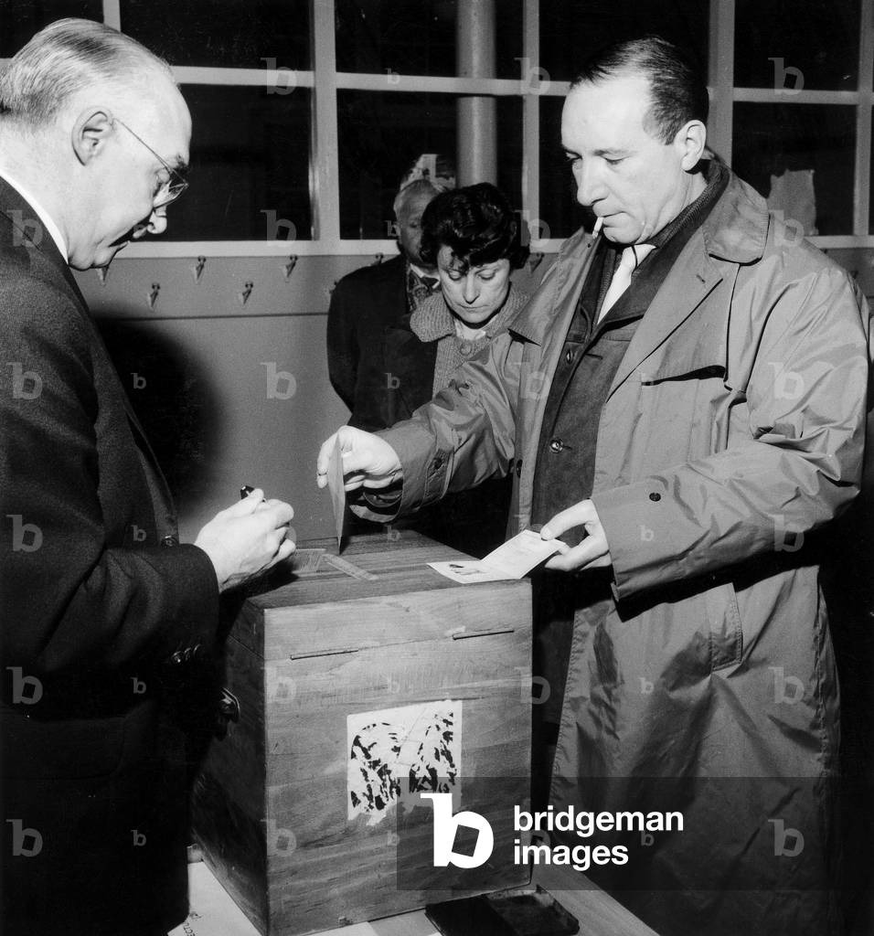 In A Polling Station in France during Referendum on Evian Agreements (End of Algerian War) on April 8, 1962 (b/w photo)