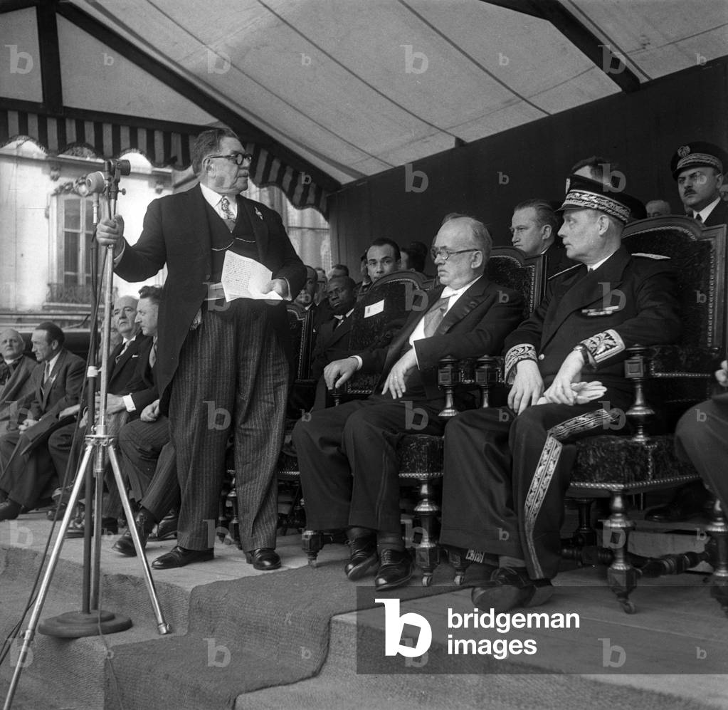 Visit of French president Vincent Auriol (seated) in Lyon, France, May 15, 1949 : Edouard Herriot (standing) (b/w photo)