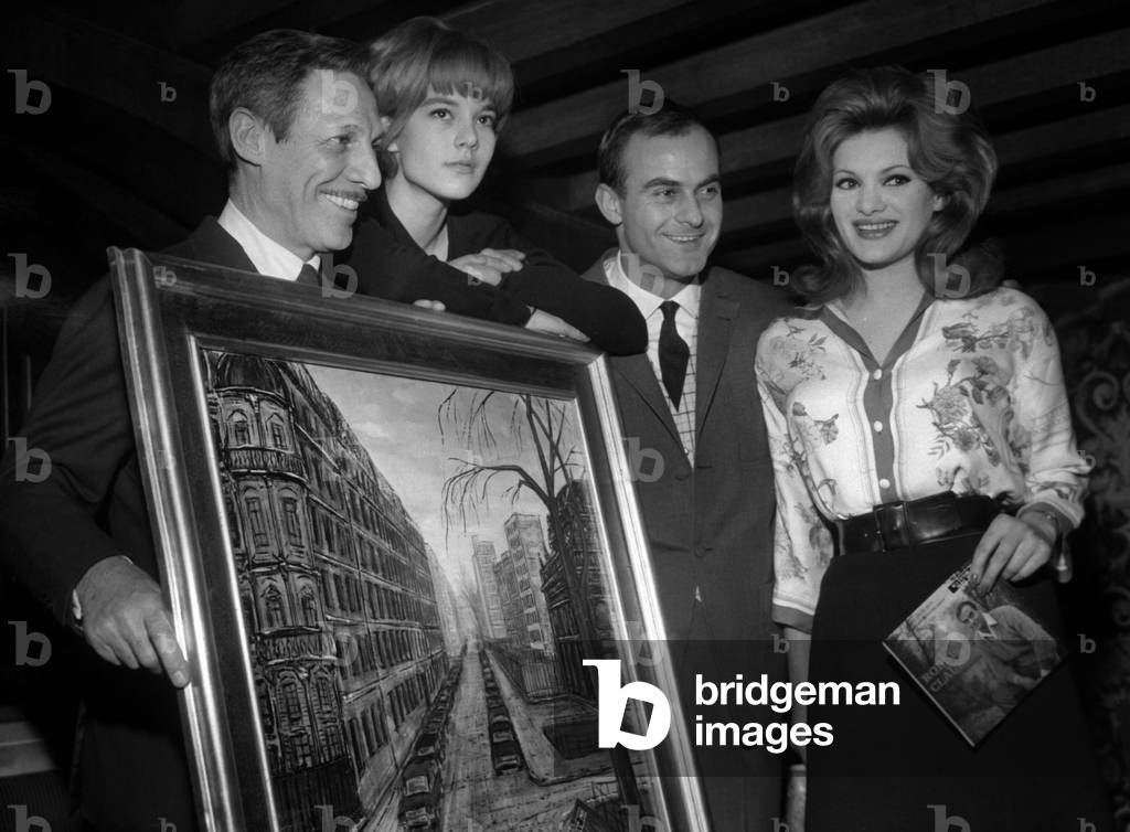 During a Cocktail At Club Saint Hilaire Robert Clausse Presenting One Of Her Paintings On Paris Surrounded By Jean Sablon Sylvie Vartan And Sylvia Sorente Who Presented The Disc De Clausse On February 6, 1963 (b/w photo)