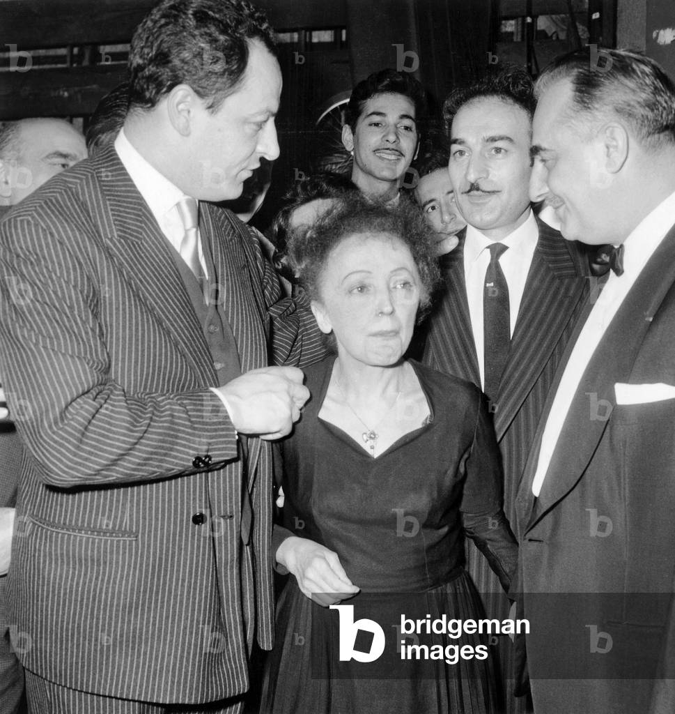 French Singer Edith Piaf at The Olympia here With Charles Dumont (L) Bruno Coquatrix (R) and Michel Rivgauche (Mustaches) December 30, 1960 (b/w photo)