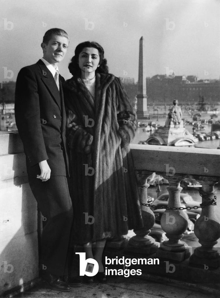 Princess Fatima Pahlavi Of Iran (Sister Of The Shah of Iran) And Her Husband American Journalist Vincent Lee Hillyer, After Their Wedding In Rome, Arriving In Paris To Try To Get A Muslim Wedding At The Mosquee That Would Give The Princess Her Hereditary Prerogatives Here At Their Paris Hotel Place De La Concorde April 25, 1950 (b/w photo)