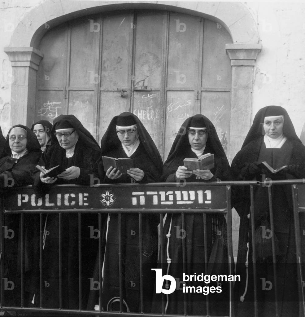 In Holy Land in January 1964, Nuns Are Waiting Praying Pope Paulvi (b/w photo)
