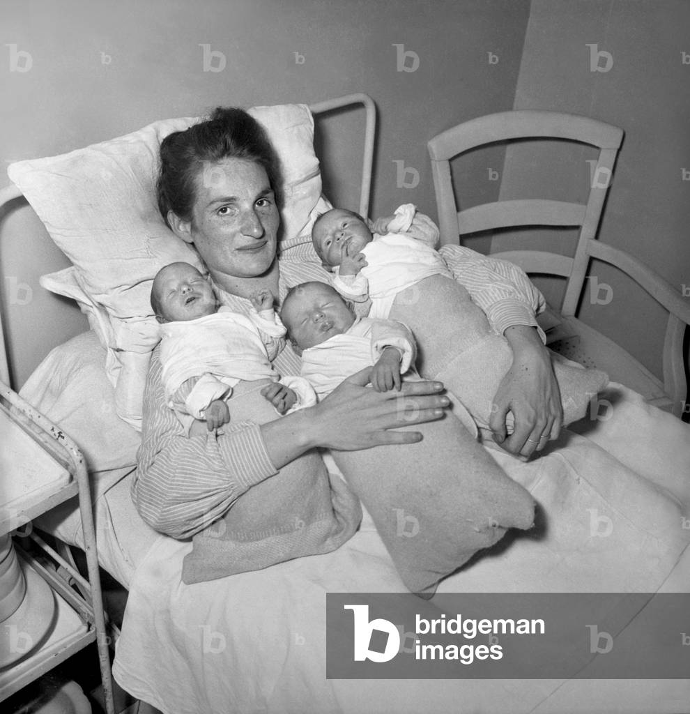 Triplets With Their Mother, Paris, December 30, 1948 (b/w photo)