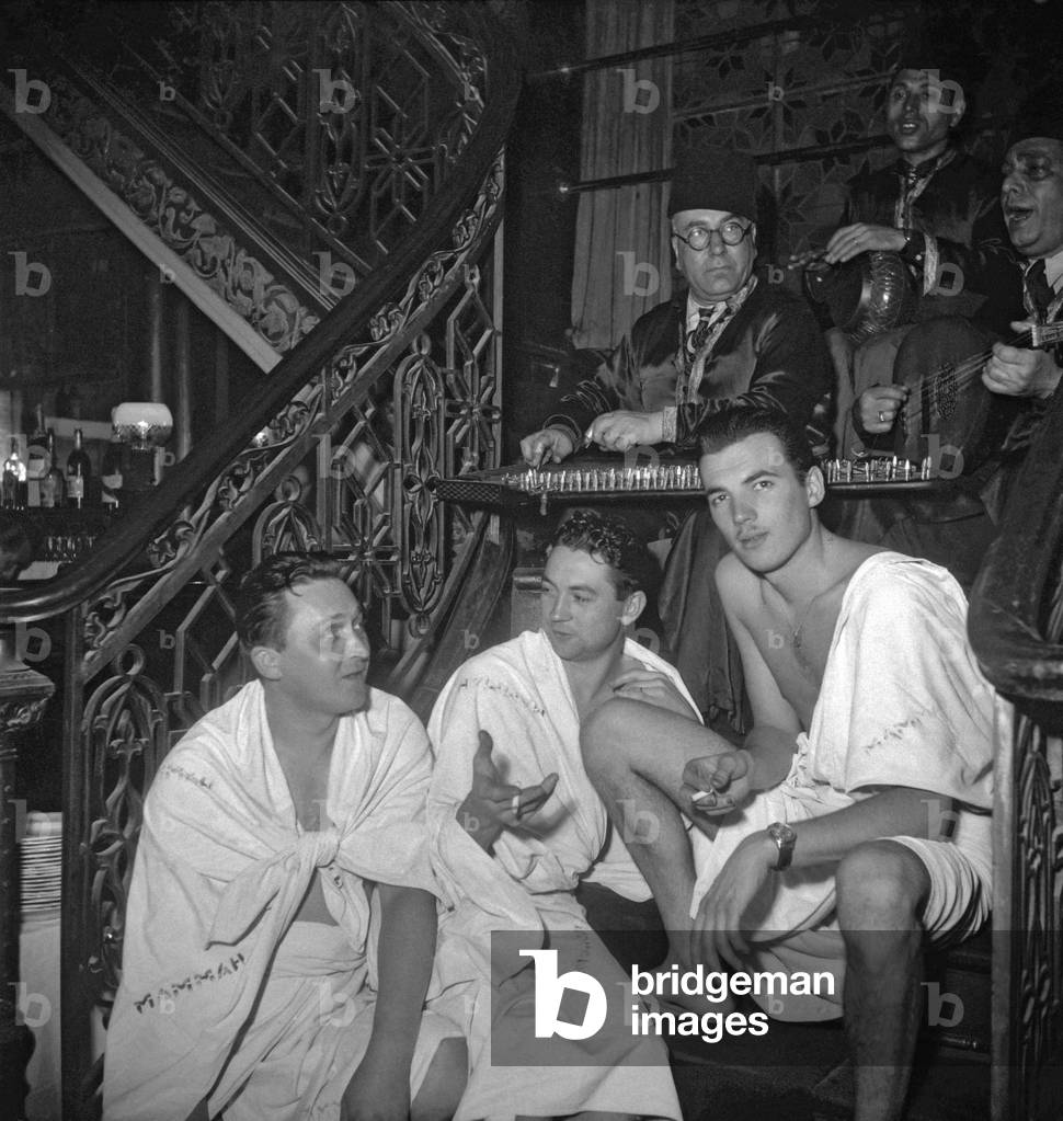 The Pieds Nickeles (Ribouldingue/Maurice Baquet, Filochard/Jean Paredes et Croquignol/Rellys) at the hammam in Paris on October 25, 1949 on set of film 