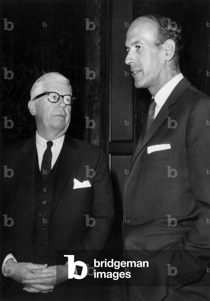 Henry Fowler (L, American Secretary of The Government Department in Charge of Public) and Valery Giscard D'Estaing (R, French Finance Minister) at The French Finance Ministry in Paris, August 30, 1965 (b/w photo)
