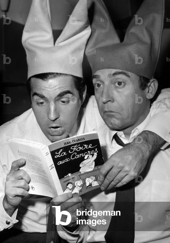 Roger Pierre and Jean-Marc Thibault Reading The Book 'La Foire Aux Cancres' Before Th Radio Programme 'La Foire Aux Cancres', September 28, 1962 (b/w photo)