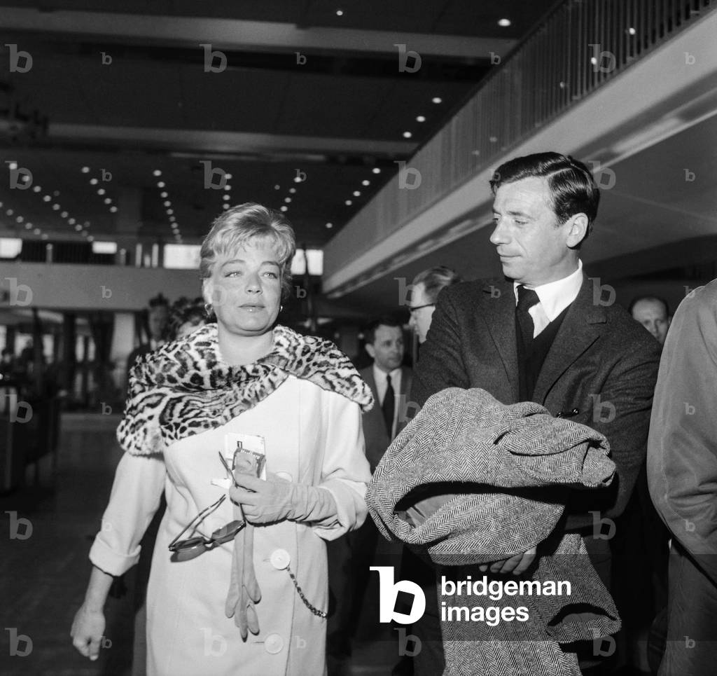 Simone Signoret welcoming Yves Montand at Orly airport, 1961 (b/w photo)