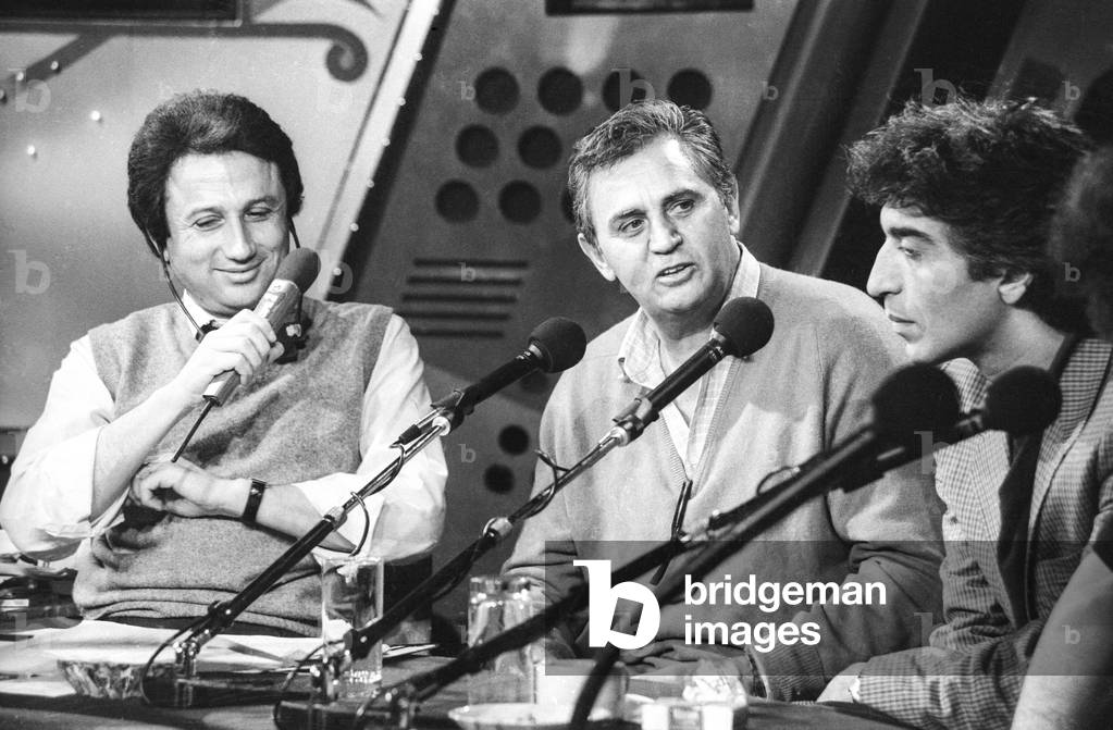 French actors Roger Hanin and Gerard Darmon on the 'Studio 1' radio programme presented by host Michel Drucker on December 7, 1983 in Paris