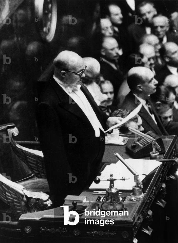 Mr Le Barter Reading President Coty's Statement at the Grandstand of the National Assembly May 20, 1958 (b/w photo)