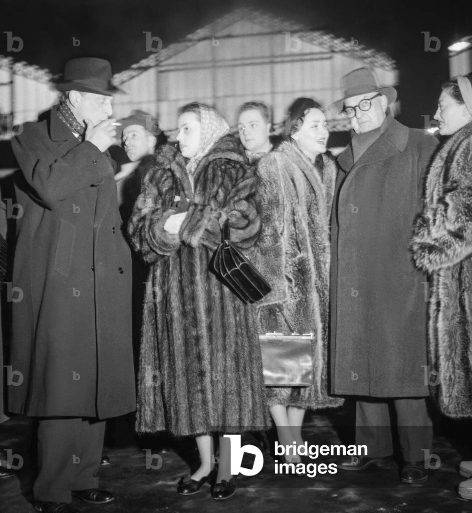 Louis Jouvet's company (actors) is leaving Paris for USA, February 27, 1951 : Louis Jouvet, Mrs Karsenty, Dominique Blanchar, Pierre Renoir and Elisa Ruis (b/w photo)