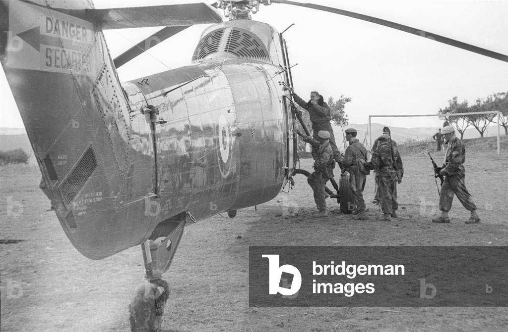 Algerian War, December 10, 1956 : members of a commando getting on an helicopter to track down rebels in the south of Oran (b/w photo)