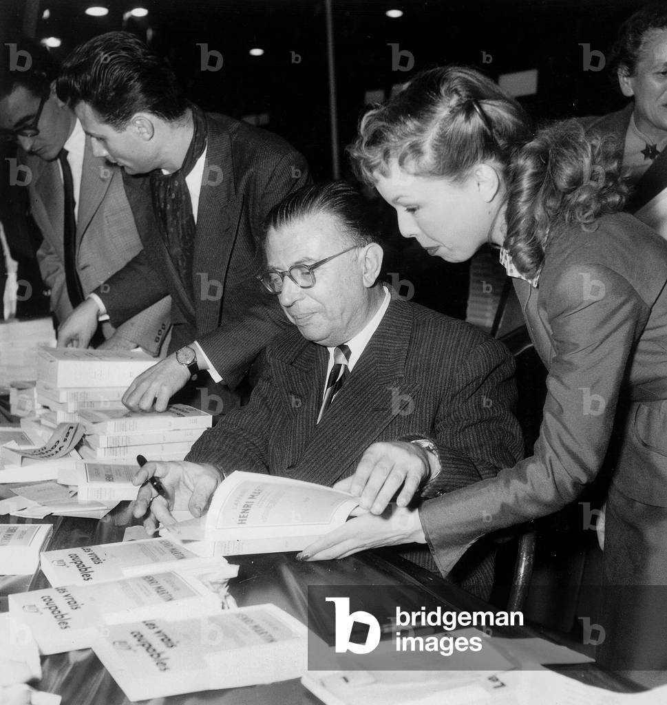 Writer Jean Paul Sartre and Cecile Aubry at Book Fair in Paris October 24, 1953 (b/w photo)