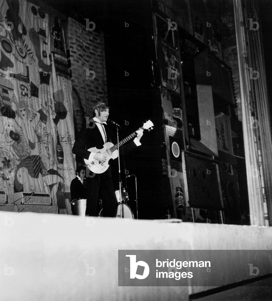 Nino Ferrer Playing Guitar on Stage at Olympia March 25, 1966 (b/w photo)
