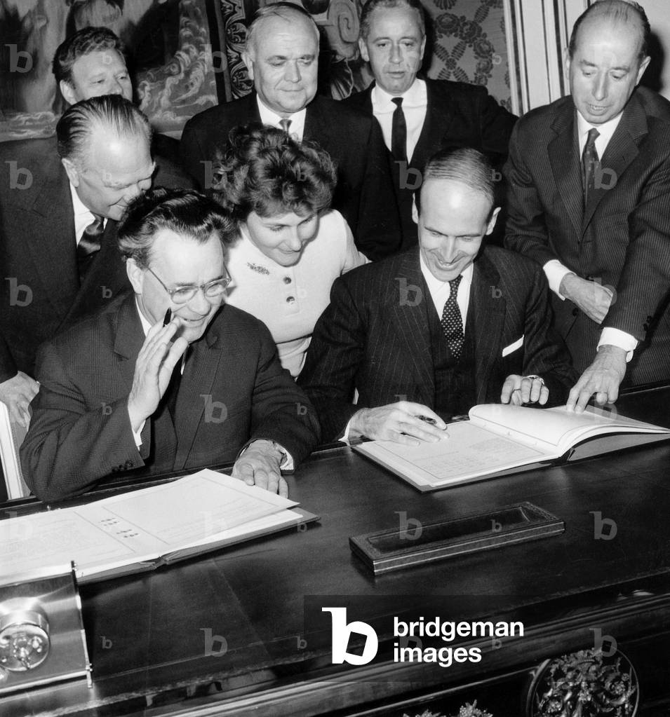 Soviet Minister of Finances Nicolas Patolitchev With his French Counterpart Valery Giscard D' Estaing in Paris Signing French-Soviet Trade Agreement on Their Sides Is Mr Sergei Vinogradov Soviet Ambassador in Paris October 30, 1964 (b/w photo)