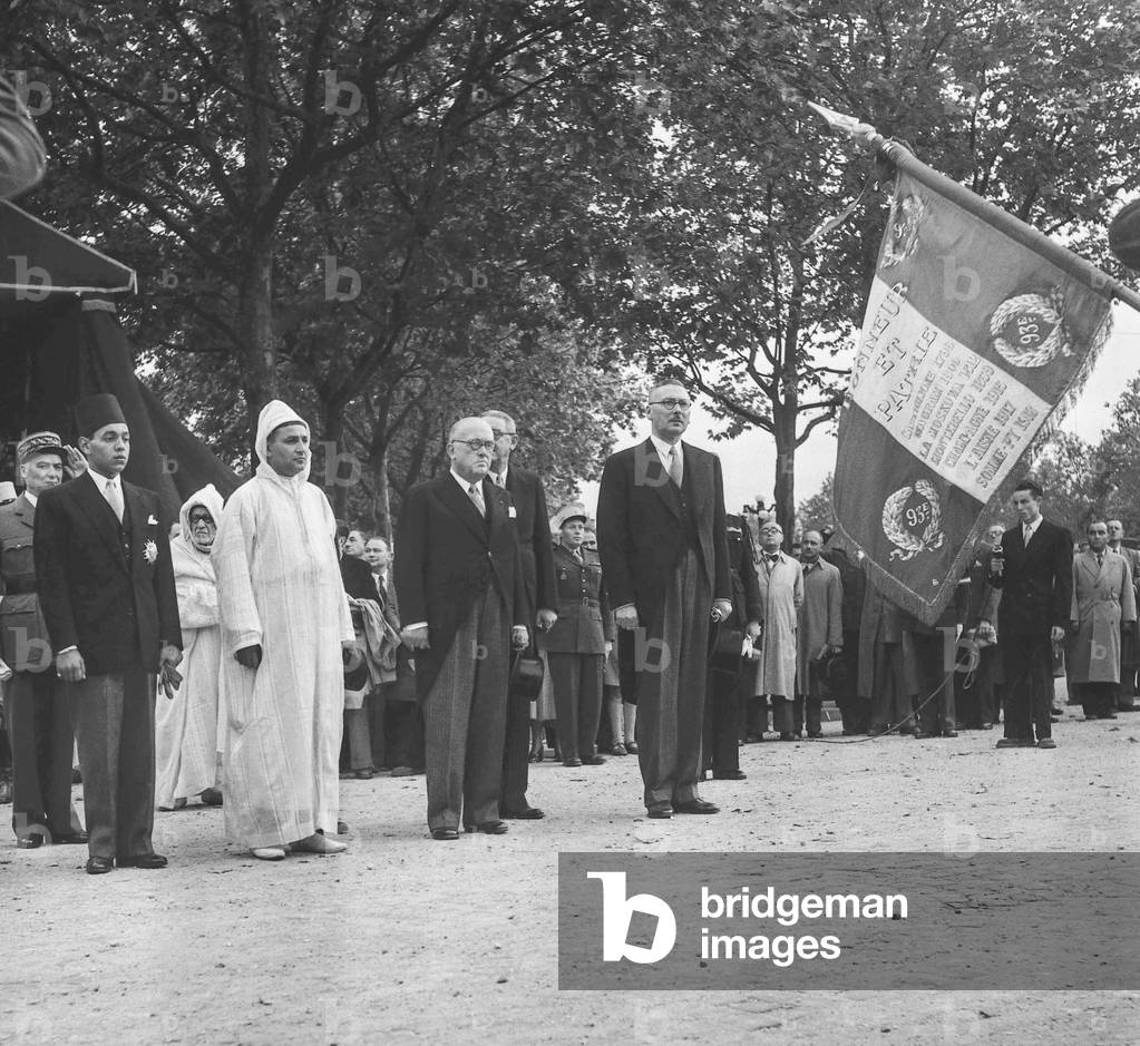 Visit in Paris of Sultan of Morocco Sidi Mohamed Ben Youssef  (Mohamed V) on October 10, 1950 : here arriving in Paris Moulay Hassan (future king Hassan II), Sultan of Morocco Sidi Mohamed Ben Youssef, French president Vincent Auriol and Rene Pleven (b/w photo)
