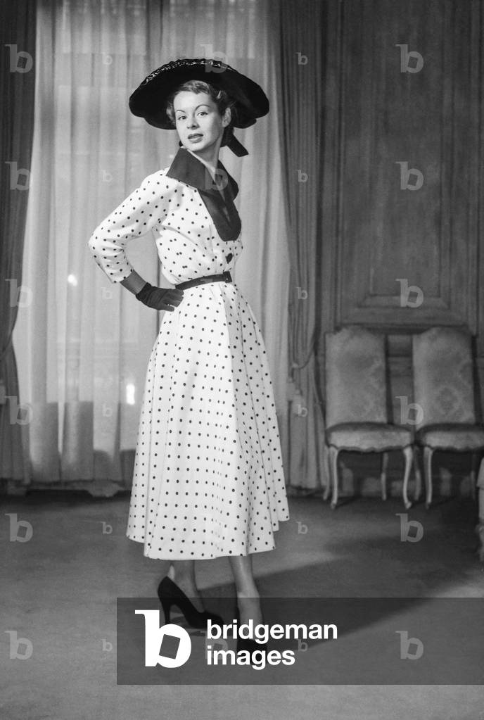 Pierre Clarence fashion, Paris, February 13, 1952 : polka dot dress, hat (b/w photo)