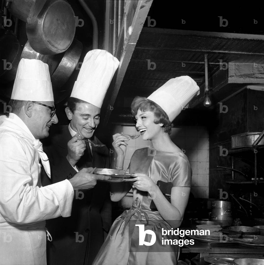 Marie-Helene Arnaud and Christian D'Oriola Eating Recipe Prepared By Chef at Maxim'S Restaurant in Paris on January 16, 1957 (b/w photo)