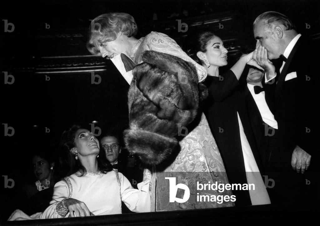French Prime Minister Georges Pompidou Hand-Kissing Maria Callas (R) While Claude Pompidou Talks With Helene Rochas (Seated) Before Attending 