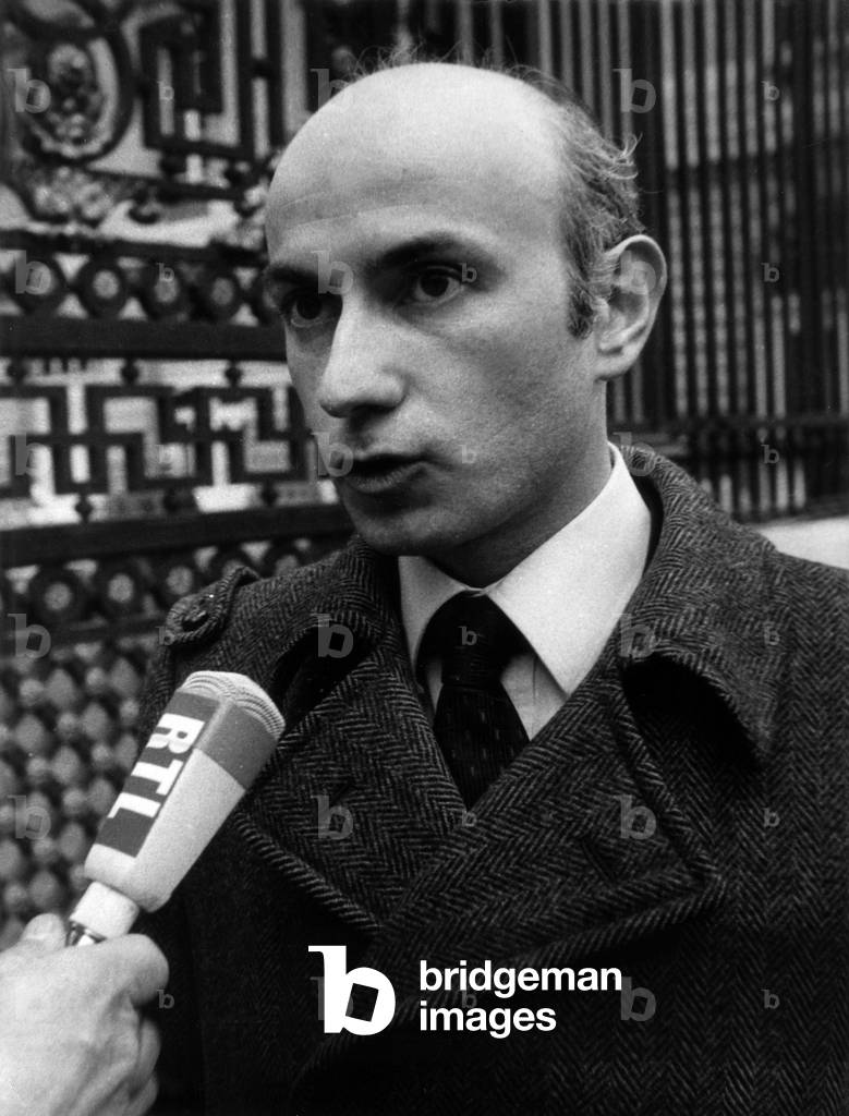 Gabriel Arnada, the Denunciator of Scandals, charged with theft of administrative documents arrives at the courthouse to confront in the office of the investigating judge Galmiche, Albin Chalendon, the former Minister of Equipment and Housing on February 7, 1973. Here he answers the journalists' questions. (b/w photo)
