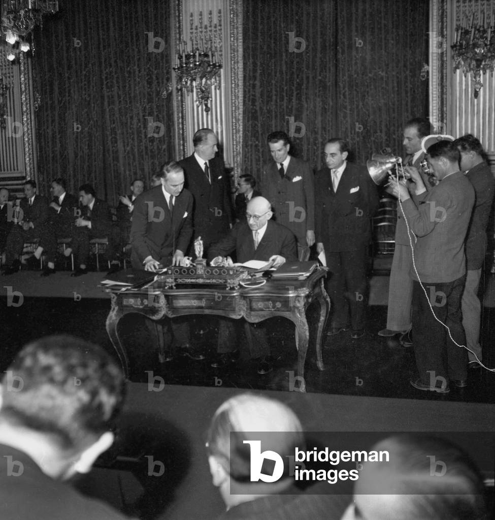 Robert Schuman Signing The Customs Union Treaty Between France and Italy in Paris on March 26, 1949 (b/w photo)