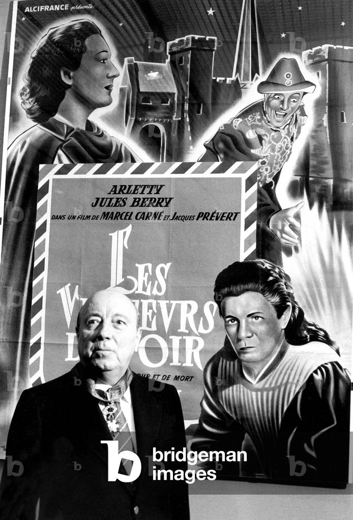Marcel Carne in Front of The Poster of The Film Lesvisiteurs D'Un Soir July, 12 1978 (b/w photo)