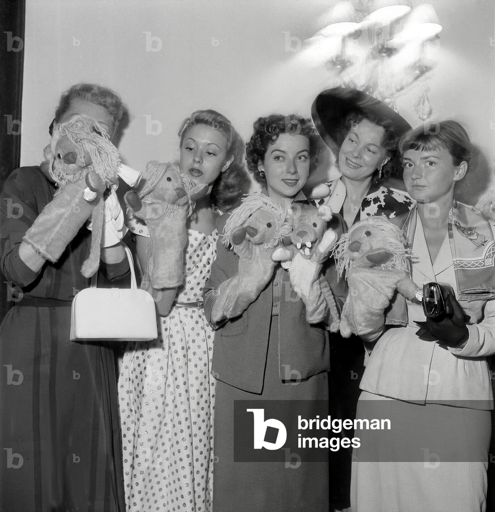Maria Riqueline and Marthe Mercadier With Junie Astor and Annette Poivre during Giving of Lucky Mascot July 8, 1952 (b/w photo)