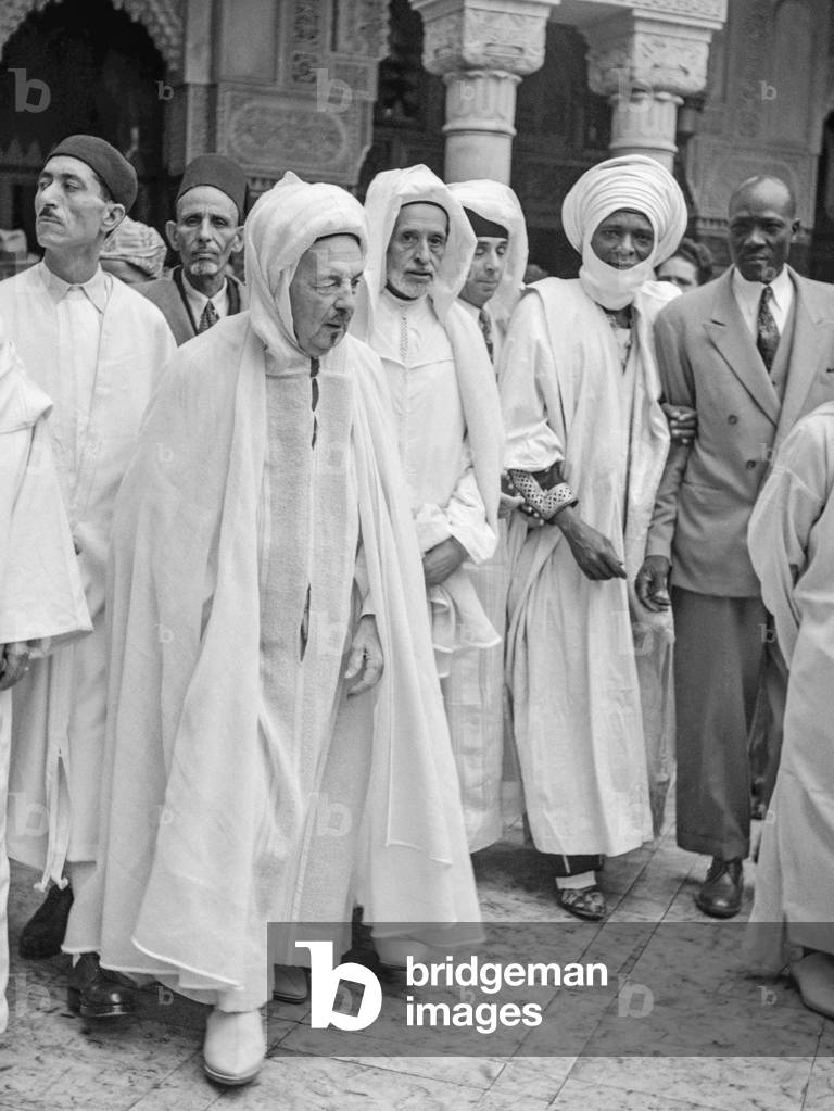 Celebration of Eid al-Fitr at the mosquee, Paris, July 16, 1950 : Si Kaddour Benghabrit (l) and Mr Arouna, senator of Cameroon (b:w photo)