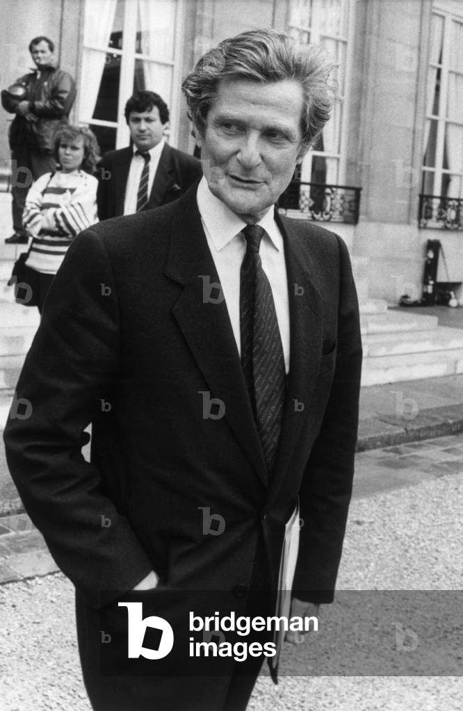 Leon Schwartzenberg, French Minister in Charge of Health, Leaving Elysee Palace in Paris After Council of Ministers, July 4, 1988 (b/w photo)
