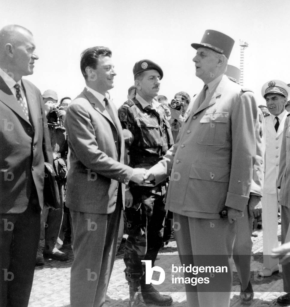 French Prime Minister Charles De Gaulle Arriving in Algiers Greeted By Leon Delbecque, and Behind : General Jacques Massu on June 4, 1958 (b/w photo)