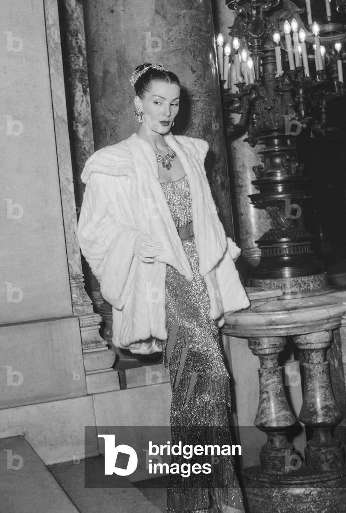 French model Lucky (Lucie Daouphars) at the gala at the Opera, Paris, organized for OdetteChurchill on October 26, 1950 (b/w photo)