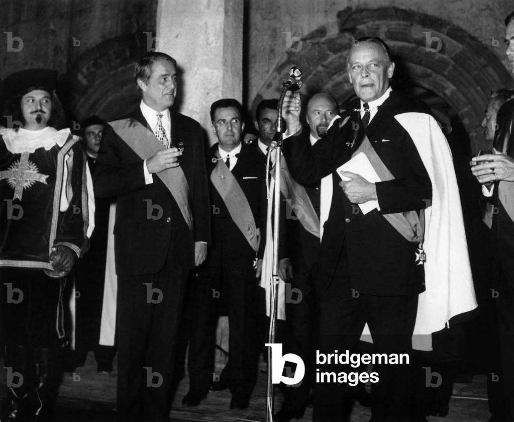 American Ambassador In Paris Robert Sargent Shriver During His Induction Of “Musketeer De L'Armagnac” At L'Abbaye De Flaran (Gers) By Le Duc De Montesquiou On September 22, 1969 (b/w photo)