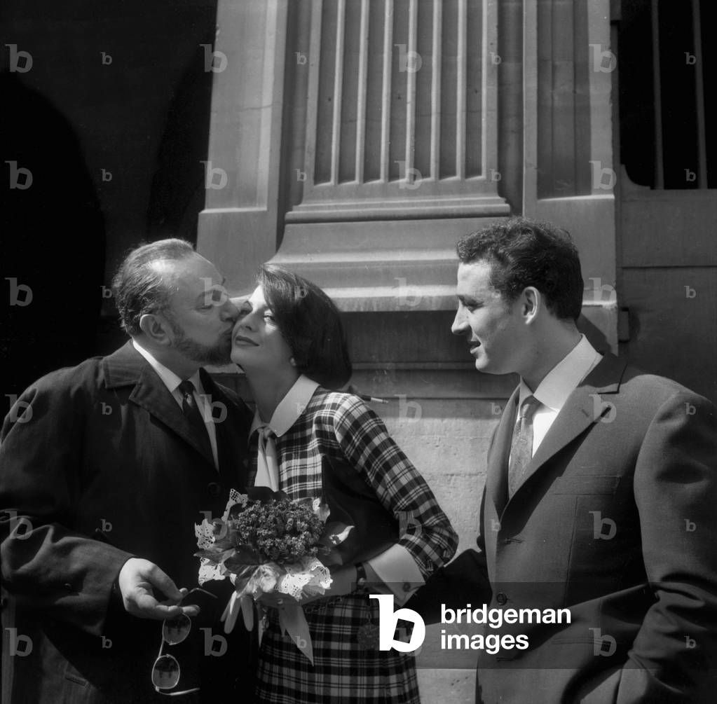 Wedding of Claude Brasseur and Peggy Roche in Paris on March 27, 1961 : Pierre Brasseur (Claude'S Father) Kissing Peggy Under Look of Claude (b/w photo)