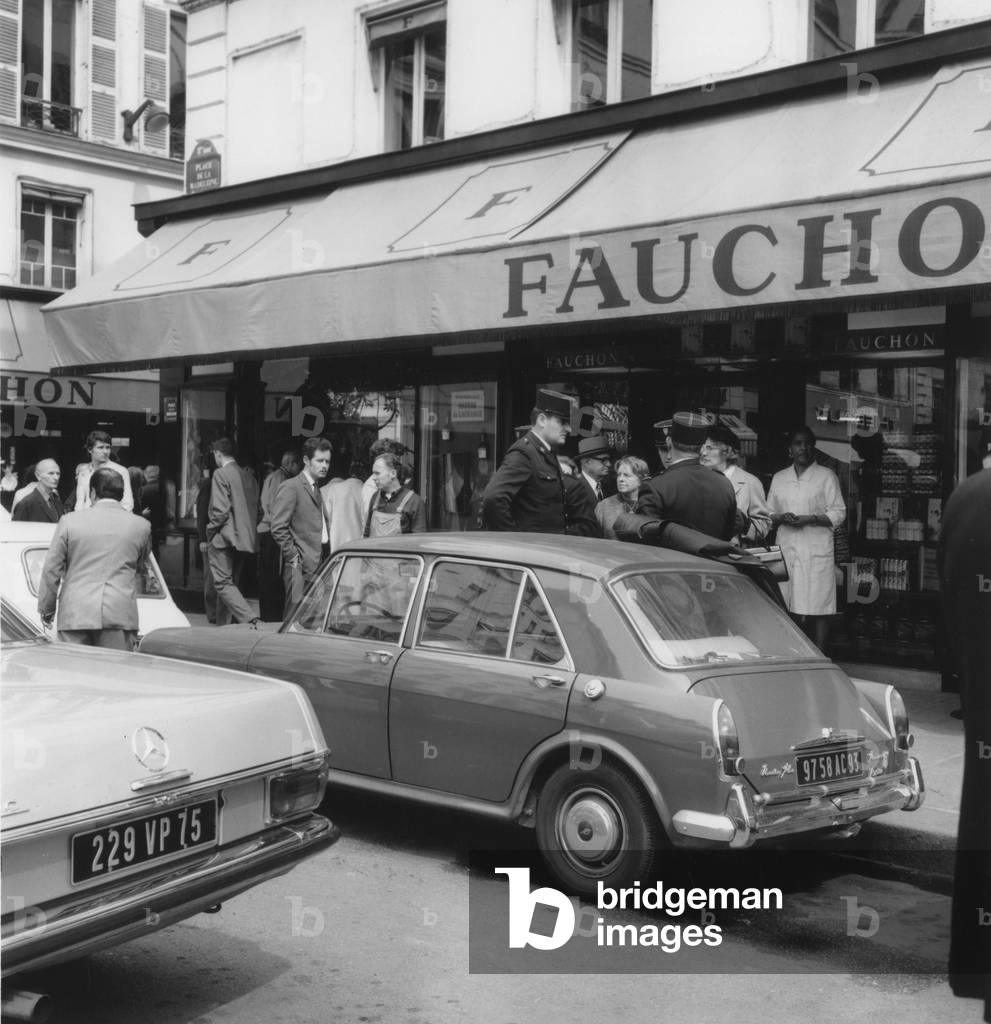 Policemen Interrogating Witnesses Outside Fauchon Shop in Paris After 20 Young People Entered The Shop To Steal Goods, The Porter Roman Sowka Chased Them Away (b/w photo)