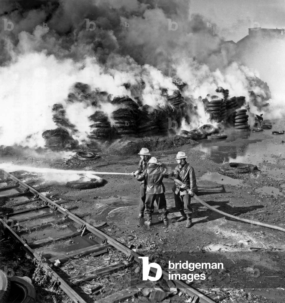Fire in A Factory of Tyres in Ivry, France, June 30, 1957 : Firemen Extinguishing The Fire (b/w photo)