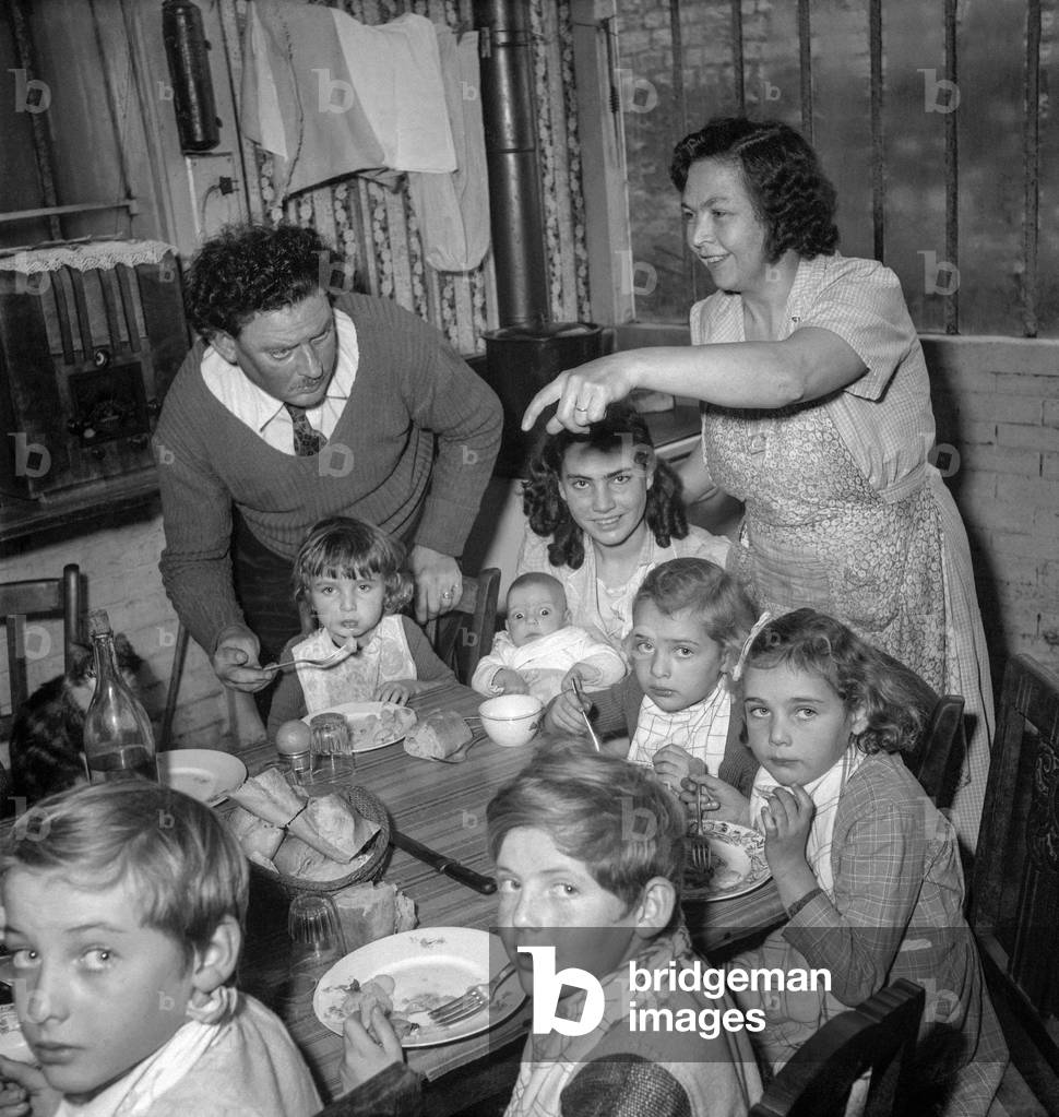 Prix Cognacq Jay (prize given by the Academie Francaise to a large family) : here the family of Mr JL Cresp, in Le Plessis Robinson, December 21, 1949 (b/w photo)