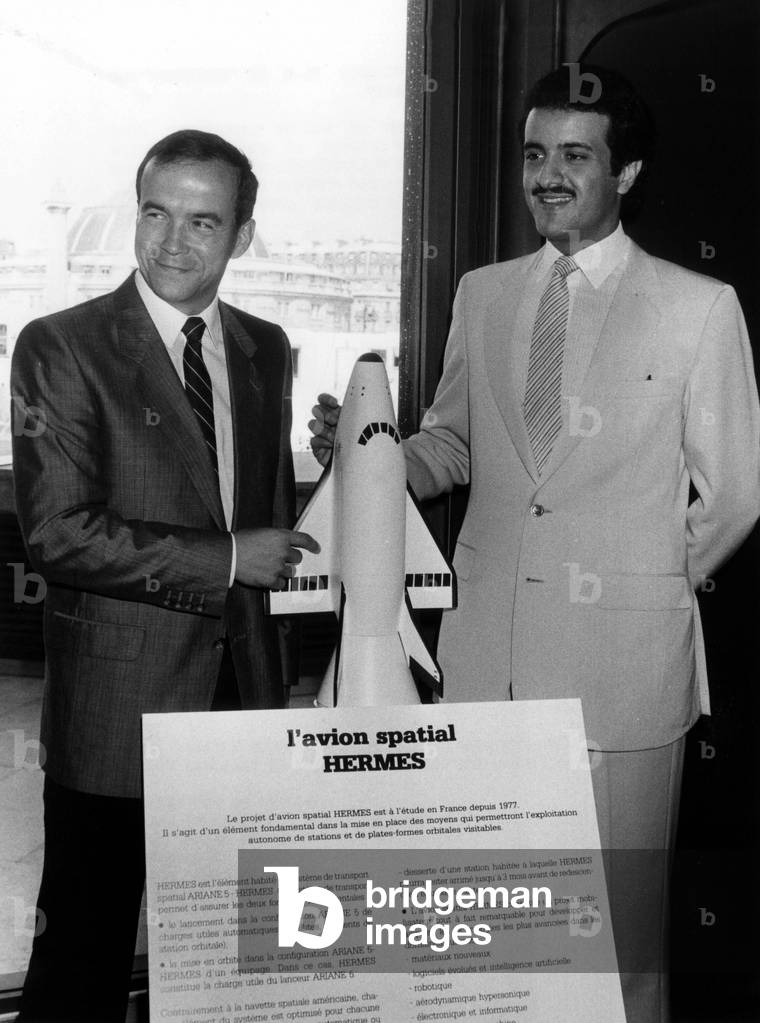 Astronaut Patrick Baudry and Saudi Prince Sultan Al-Saud in front of the model of the future French Space Shuttle “Hermes” in Paris at the Centre Du Cnes during a press conference on September 2, 1985. (b/w photo)
