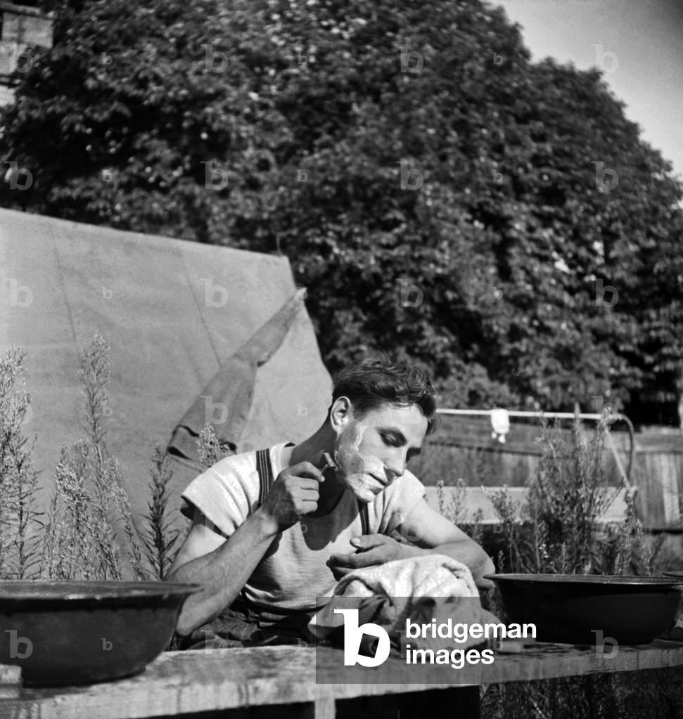 Camping in France, July 1947 : Young Man Shaving (b/w photo)