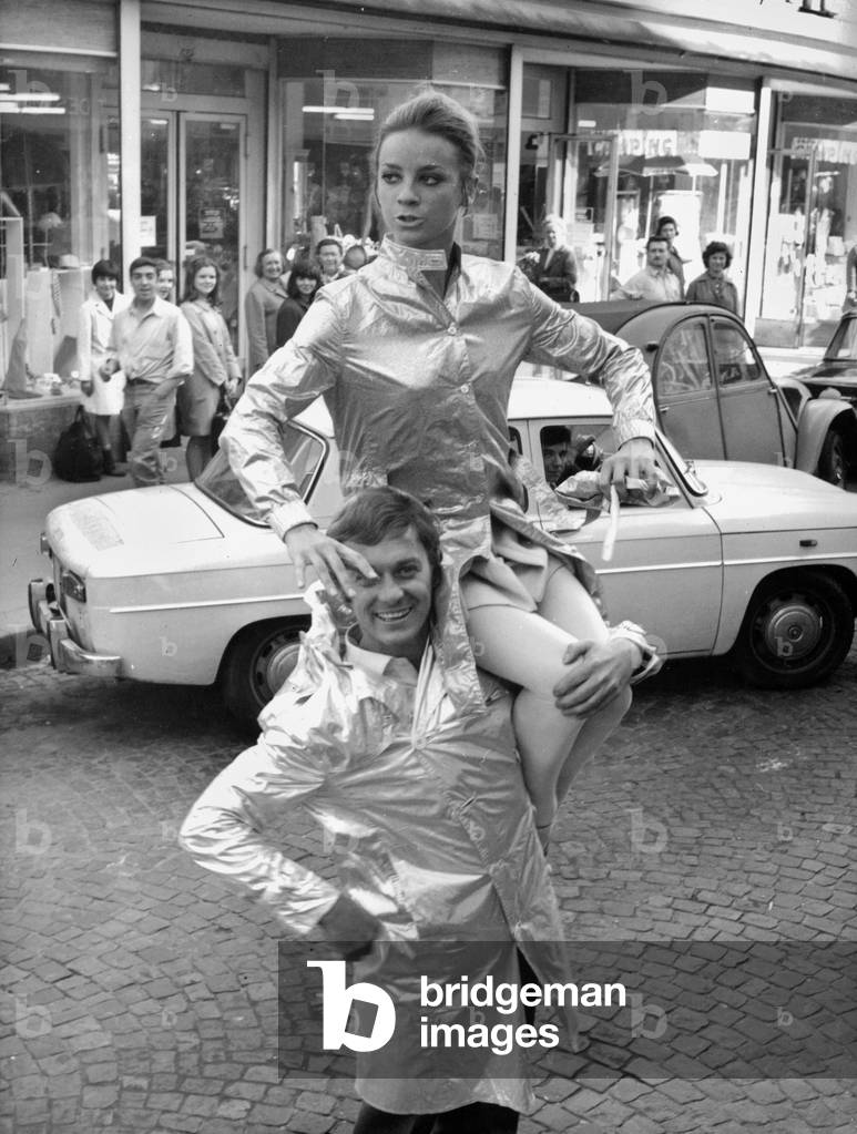 Dancer Milorad Miskovitch Carrying on his Shoulder Dancer Muriel Belmondo in Front of Bobino Theatre in Paris in May 1967 (b/w photo)