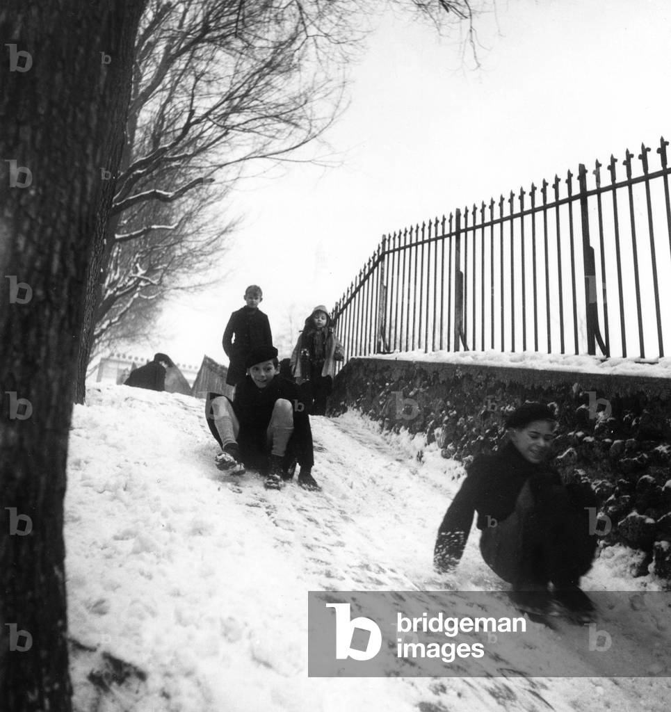 Children Going Tobogganing in Snwo in Montmartre, Paris, February 1St, 1947 (b/w photo)