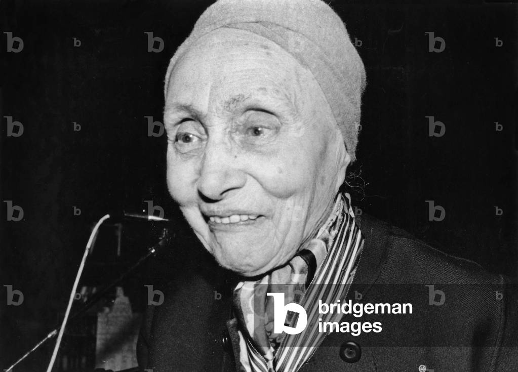 French Minister of Culture Jacklang Decorating French Fashion Designer Mrs Gres (1903-1993, Born Germaine Emilie Krebs Also Known As Alix Barton) With The Cross of Commander of Arts and Letters October 14, 1983 (b/w photo)